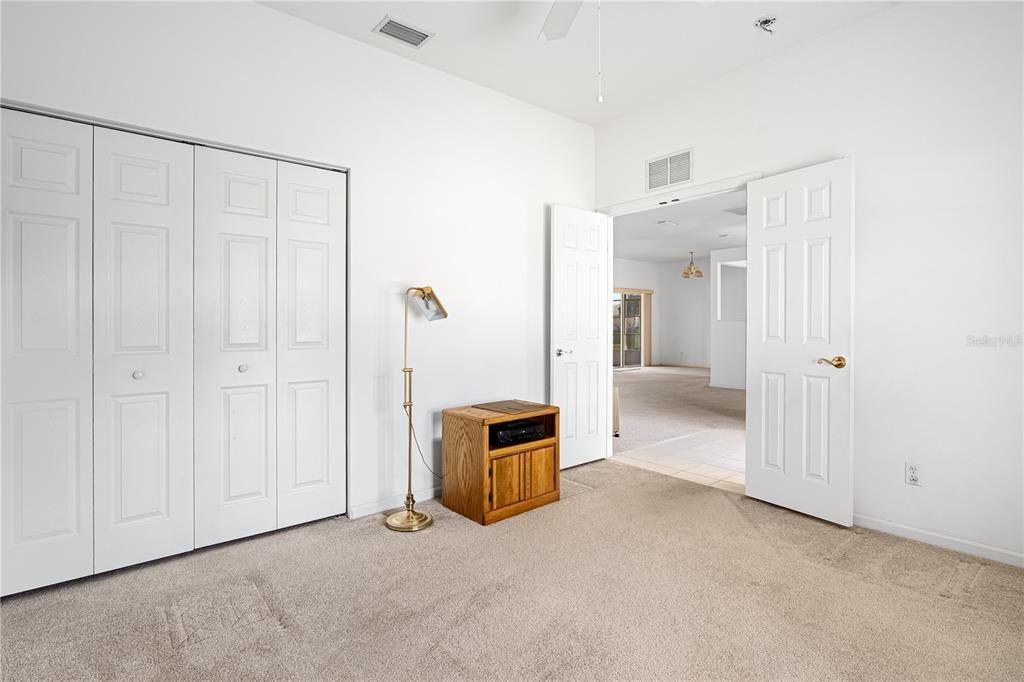 2459 Northwest 55th Avenue Road Ocala, FL 34482 - Photo 22 of 38 a view of a closet area with ceiling fan