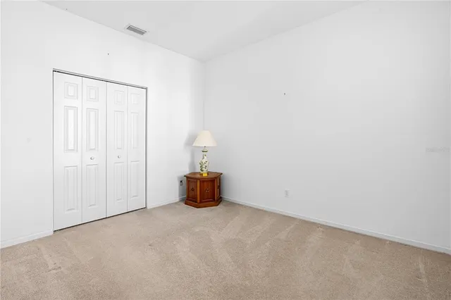 a view of empty room with windows