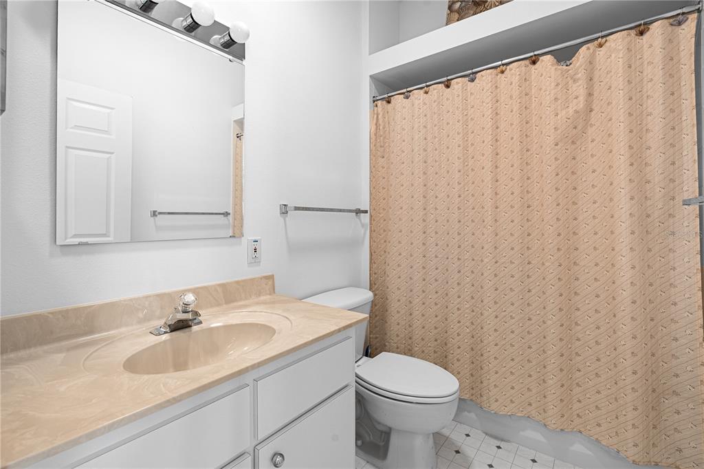 2459 Northwest 55th Avenue Road Ocala, FL 34482 - Photo 25 of 38 a bathroom with a sink and a toilet