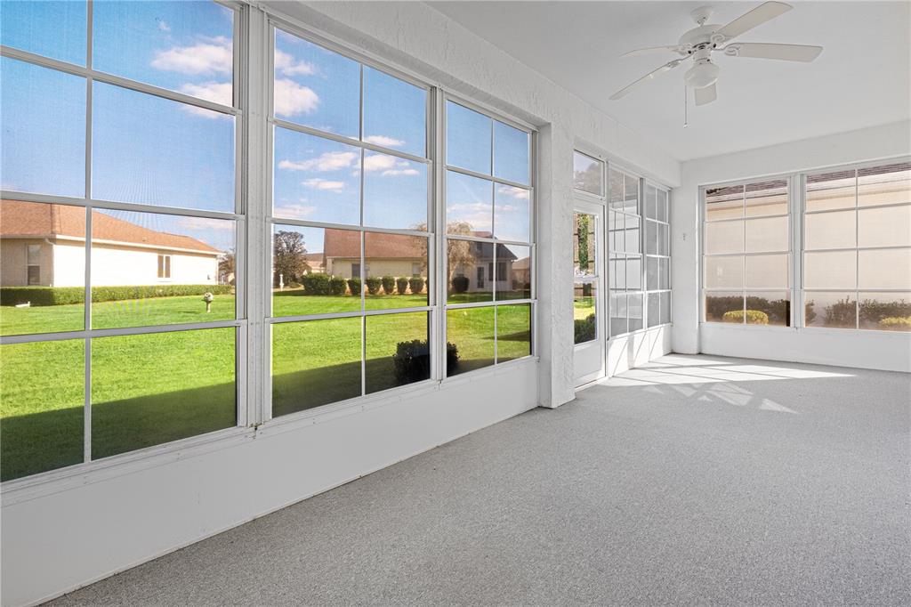 2459 Northwest 55th Avenue Road Ocala, FL 34482 - Photo 26 of 38 a view of an empty room with a large window with kitchen view