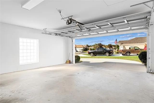 an aerial view of multiple houses with yard