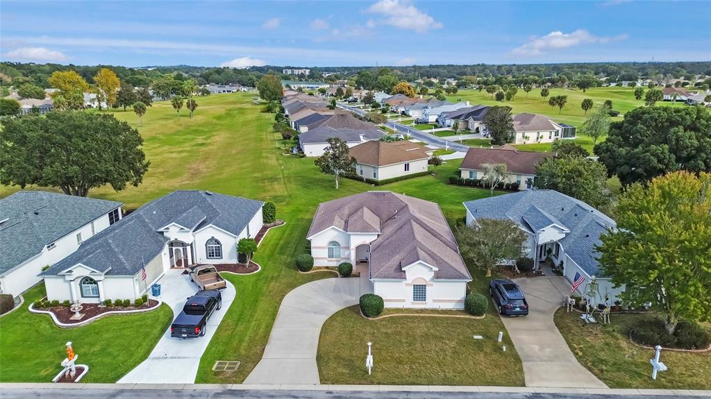 2459 Northwest 55th Avenue Road Ocala, FL 34482 - Photo 31 of 38 an aerial view of multiple houses with yard