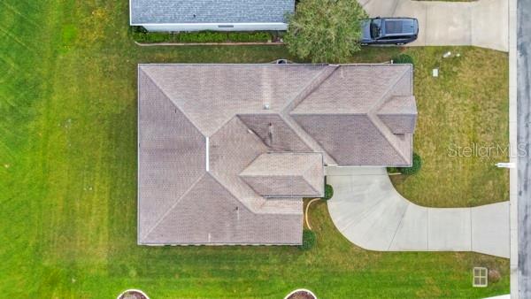 2459 Northwest 55th Avenue Road Ocala, FL 34482 - Photo 32 of 38 an aerial view of a house with a garden and a swimming pool