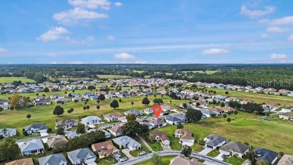 2459 Northwest 55th Avenue Road Ocala, FL 34482 - Photo 34 of 38 an aerial view of a city with lots of residential buildings and mountain view in back