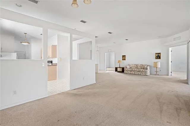 a view of a livingroom with a kitchen