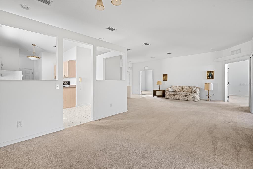 2459 Northwest 55th Avenue Road Ocala, FL 34482 - Photo 9 of 38 a view of a livingroom with a kitchen