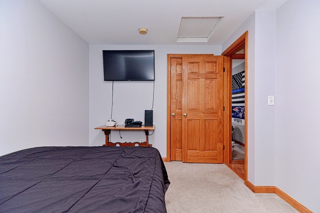 494 S Road Templeton, MA 01468 - Photo 20 of 34 a bedroom with a bed and a flat screen tv