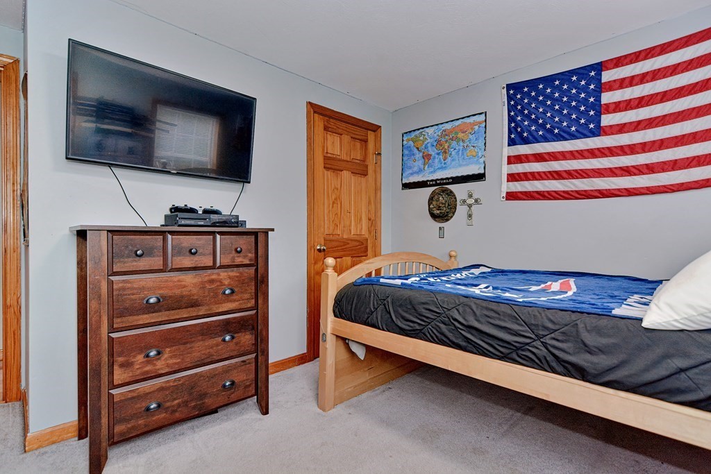 494 S Road Templeton, MA 01468 - Photo 23 of 34 a bedroom with a bed and flat screen tv