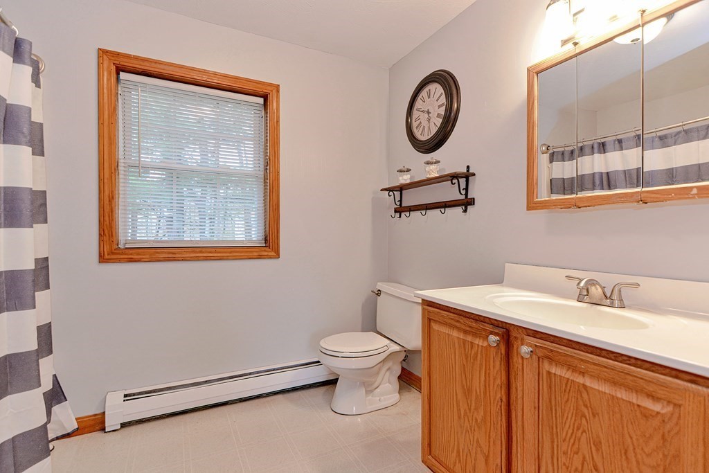 494 S Road Templeton, MA 01468 - Photo 24 of 34 a bathroom with a toilet a sink and a mirror