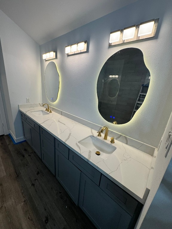 2710 Hullsmith Drive, Unit 701 Houston, TX 77063 - Photo 13 of 19 a bathroom with a double vanity sink and a mirror