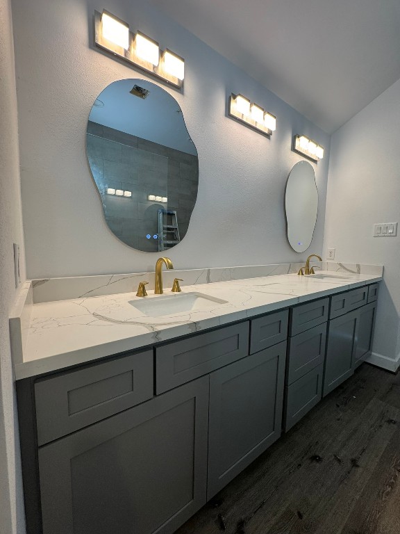 2710 Hullsmith Drive, Unit 701 Houston, TX 77063 - Photo 16 of 19 a bathroom with a double vanity sink and a mirror