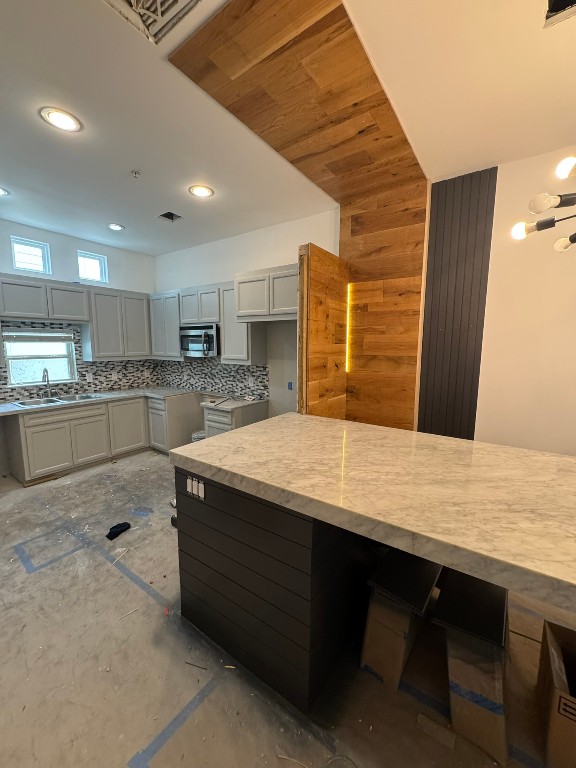 2710 Hullsmith Drive, Unit 701 Houston, TX 77063 - Photo 18 of 19 a kitchen with kitchen island sink and refrigerator
