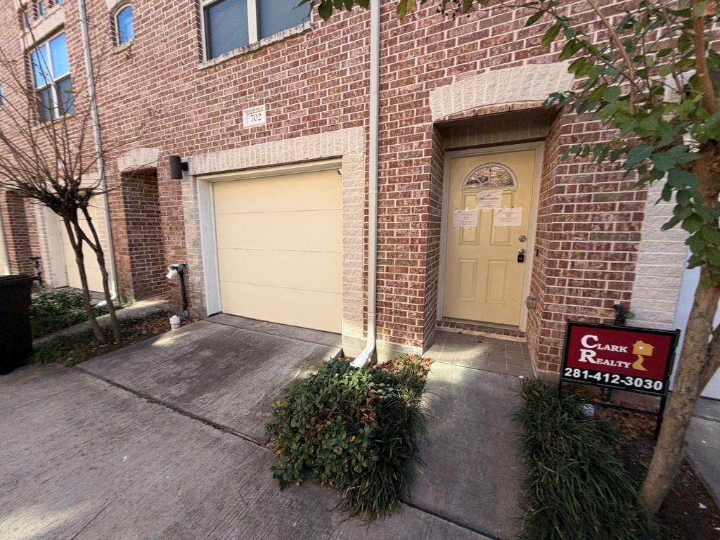 2710 Hullsmith Drive, Unit 701 Houston, TX 77063 - Photo 3 of 19 a brick building with a large windows