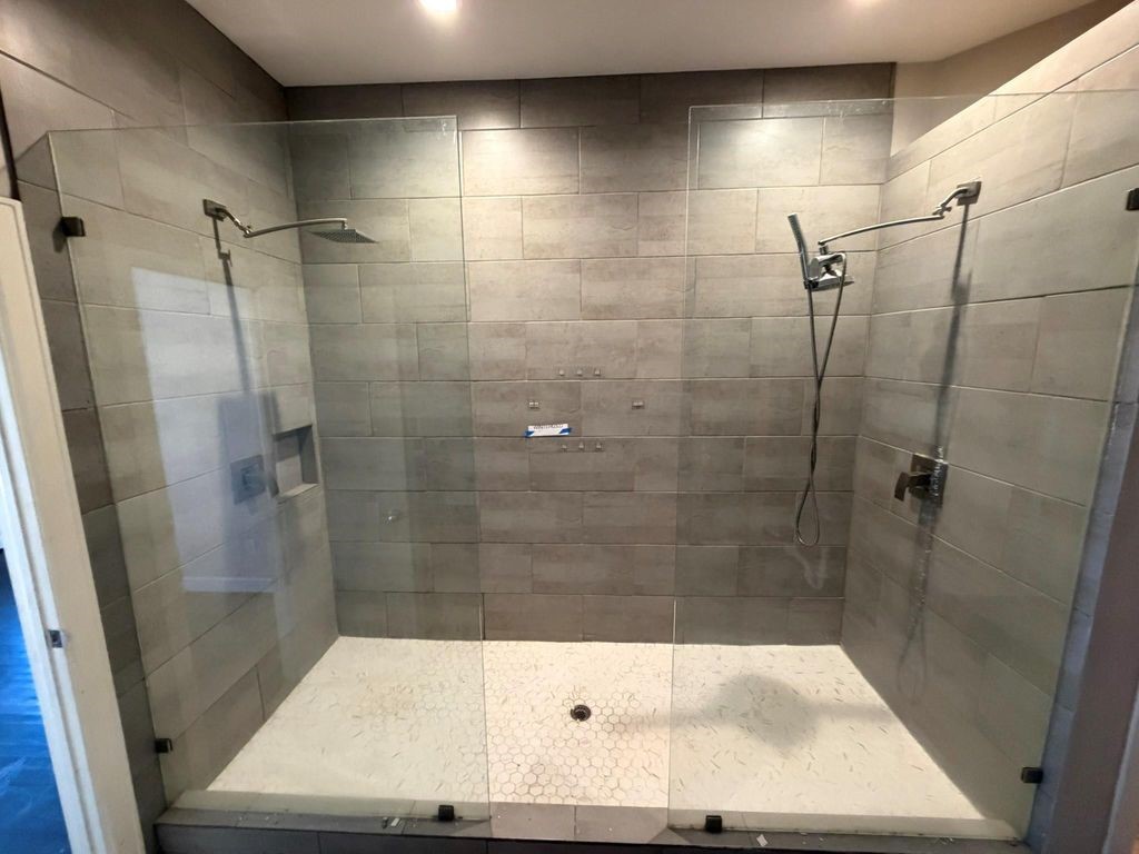 2710 Hullsmith Drive, Unit 701 Houston, TX 77063 - Photo 7 of 19 a bathroom with a shower and a sink