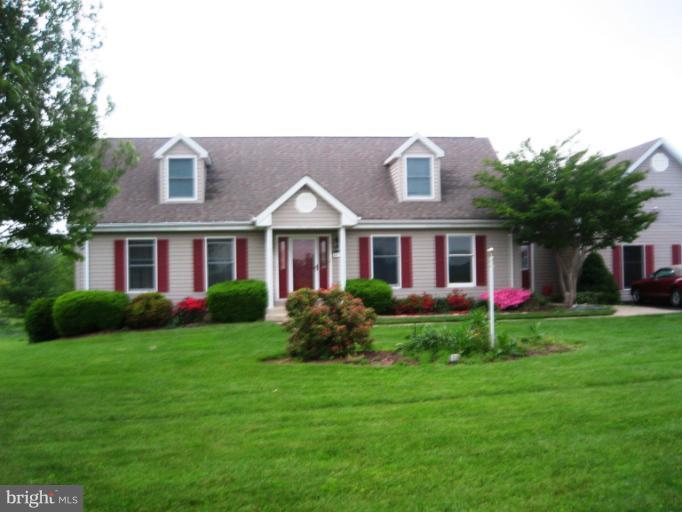 28731 Kemptown Road Mount Airy, MD 21771 - Photo 2 of 30 a front view of a house with a yard and garage