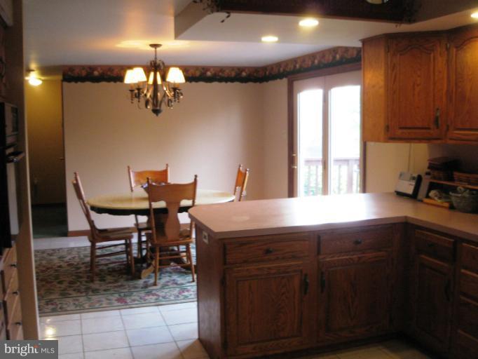 28731 Kemptown Road Mount Airy, MD 21771 - Photo 14 of 30 a kitchen with a table and chairs in it