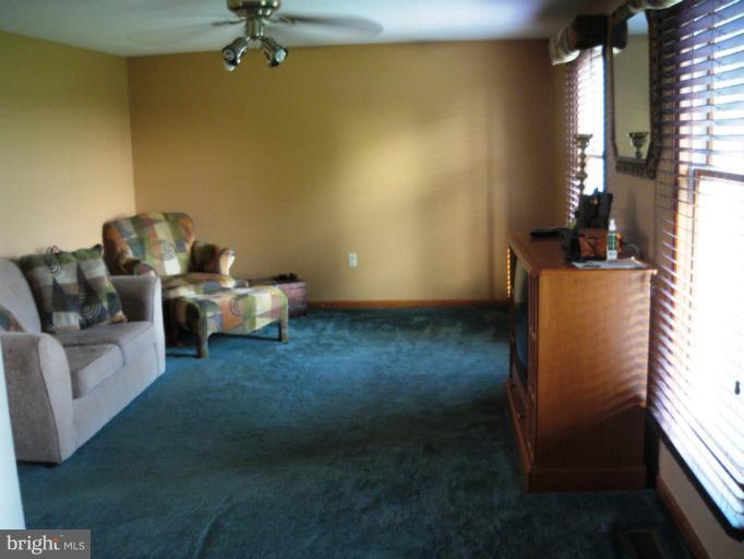 28731 Kemptown Road Mount Airy, MD 21771 - Photo 15 of 30 a living room with furniture and a window