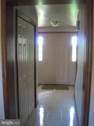 28731 Kemptown Road Mount Airy, MD 21771 - Photo 25 of 30 an empty room with wooden floor and windows