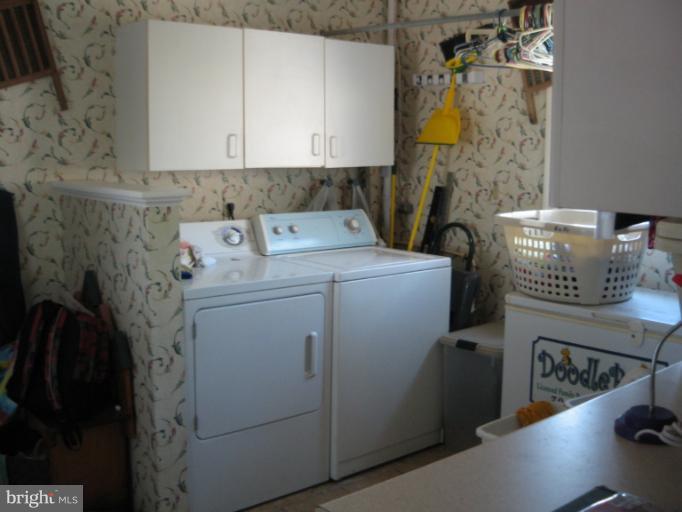 28731 Kemptown Road Mount Airy, MD 21771 - Photo 27 of 30 a view of storage and utility room with washer and dryer