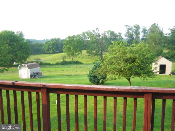 28731 Kemptown Road Mount Airy, MD 21771 - Photo 4 of 30 a balcony with trees in front of it