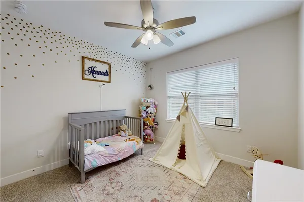 a bedroom with furniture and a chandelier