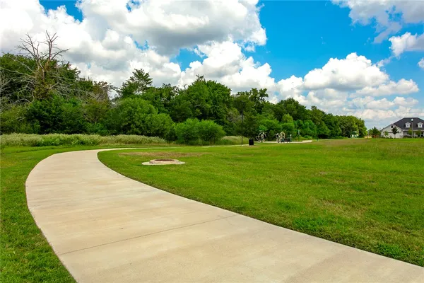 a view of a garden with a fountain