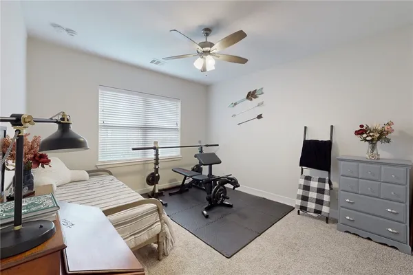 a work room with furniture and wooden floor