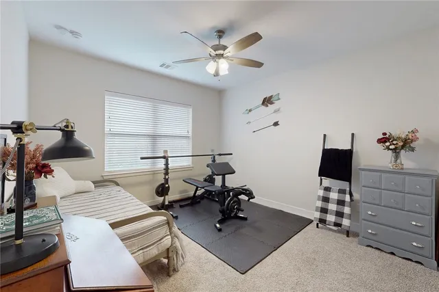 a work room with furniture and wooden floor