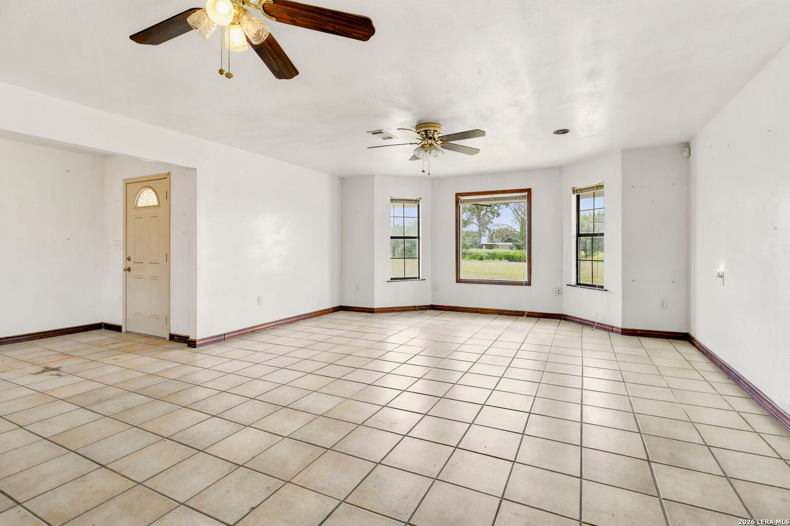 3061 Horse Ranch Road San Antonio, TX 78264 - Photo 5 of 34 a view of an empty room with windows
