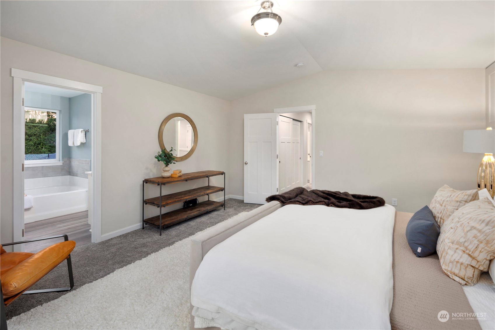 10981 Southeast 165th Street Renton, WA 98055 - Photo 17 of 38 a bedroom with a bed and a couch