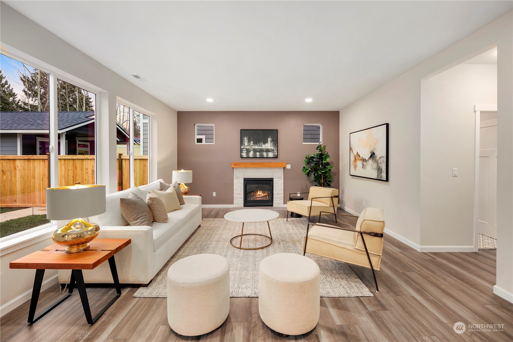 10981 Southeast 165th Street Renton, WA 98055 - Photo 7 of 38 a living room with furniture a window and a fireplace