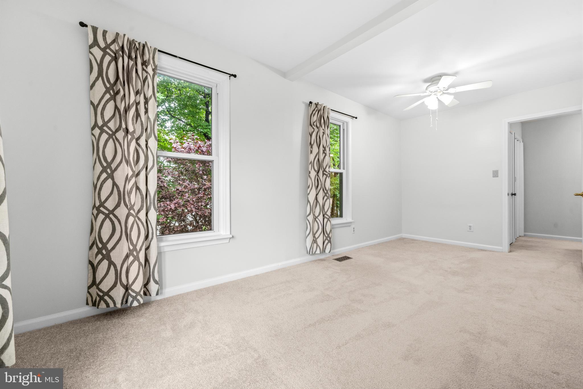 6001 Rabbit Hill Court Centreville, VA 20121 - Photo 26 of 46 an empty room with windows and ceiling fan