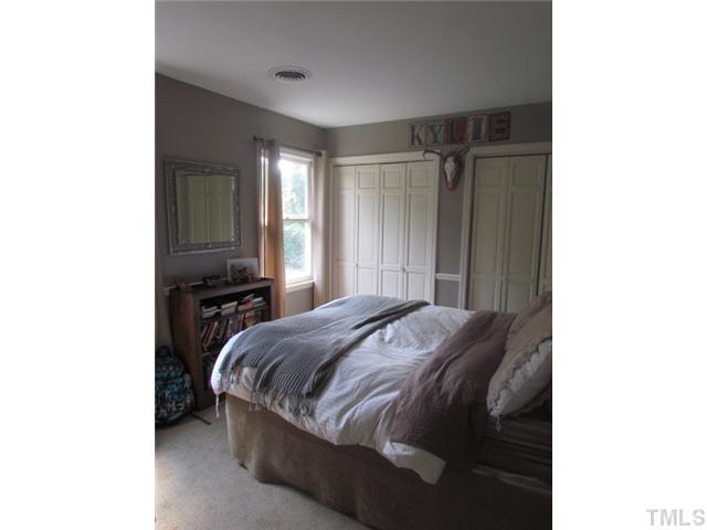 356 Shiloh Church Road Roxboro, NC 27574 - Photo 18 of 24 a bedroom with a bed and a cabinets