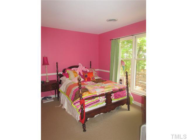 356 Shiloh Church Road Roxboro, NC 27574 - Photo 20 of 24 a bedroom with a bed and a window