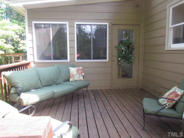 356 Shiloh Church Road Roxboro, NC 27574 - Photo 21 of 24 a view of a house with couches wooden floor