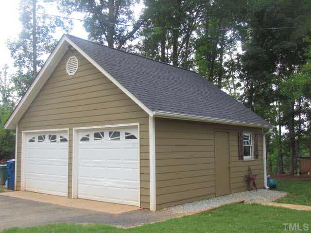 356 Shiloh Church Road Roxboro, NC 27574 - Photo 23 of 24 a front view of a house with a yard and garage