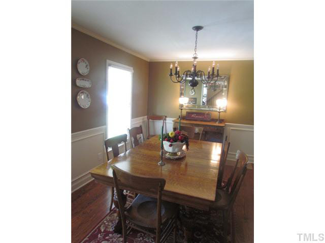 356 Shiloh Church Road Roxboro, NC 27574 - Photo 10 of 24 a view of a dining room with furniture and chandelier