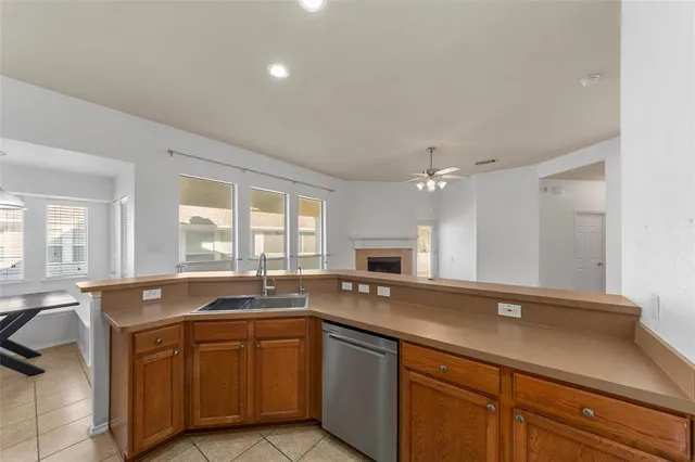 a kitchen with a sink stove and microwave