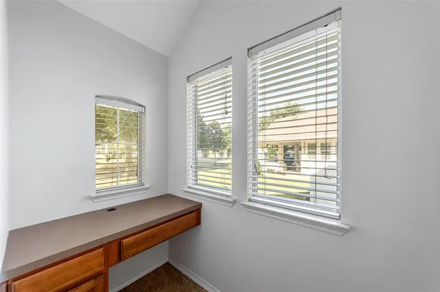 a room that has a chair and a window