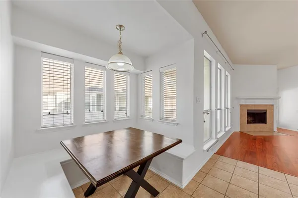 a view of a livingroom with a furniture window and wooden floor