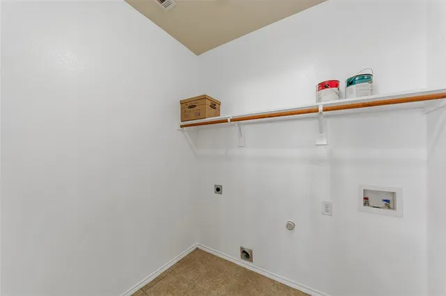 a view of a closet with wooden floor