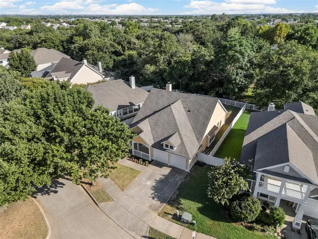 an aerial view of residential house with outdoor space and swimming pool