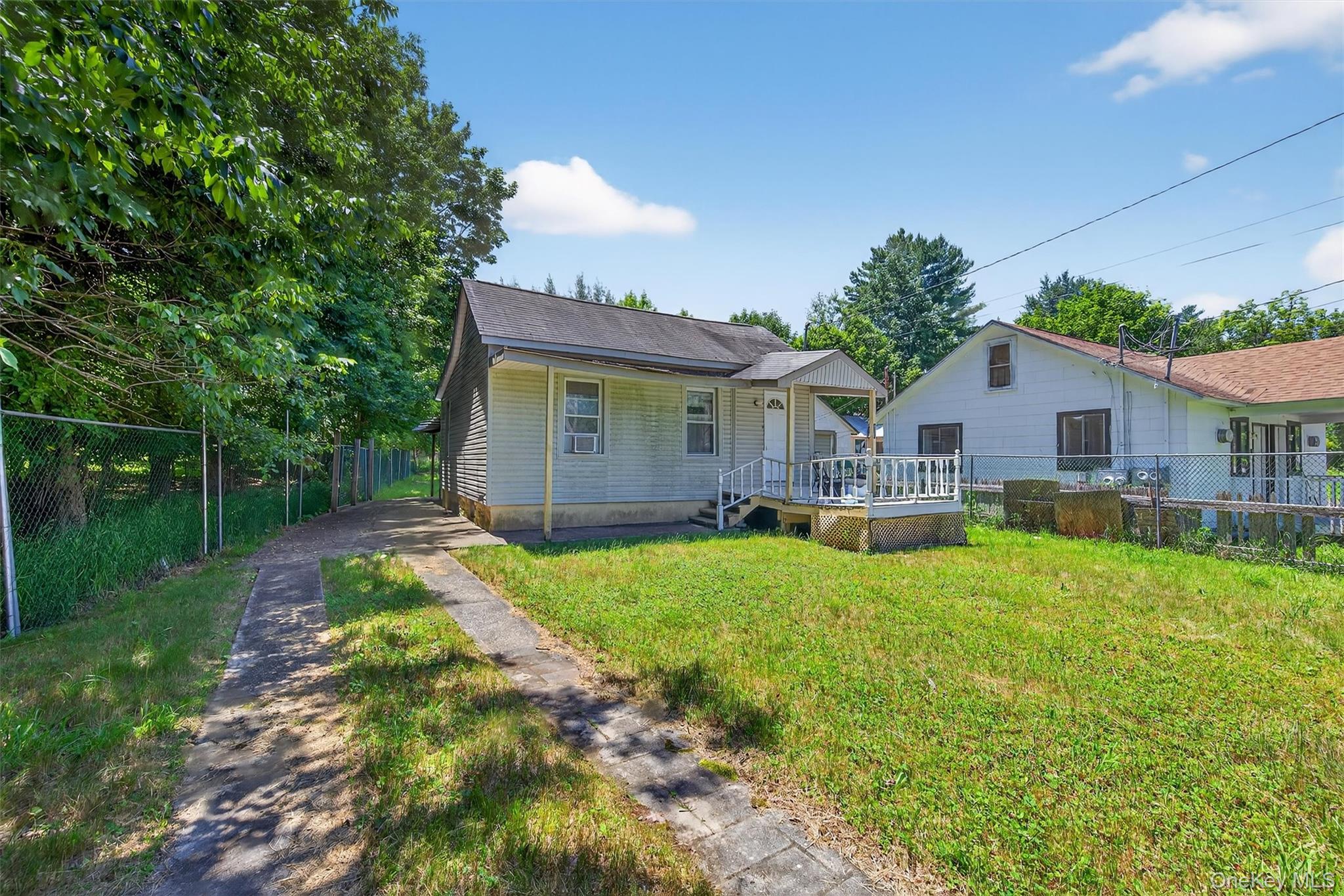 17 Dillon Road Monticello, NY 12701 - Photo 1 of 17 a front view of house with yard and green space