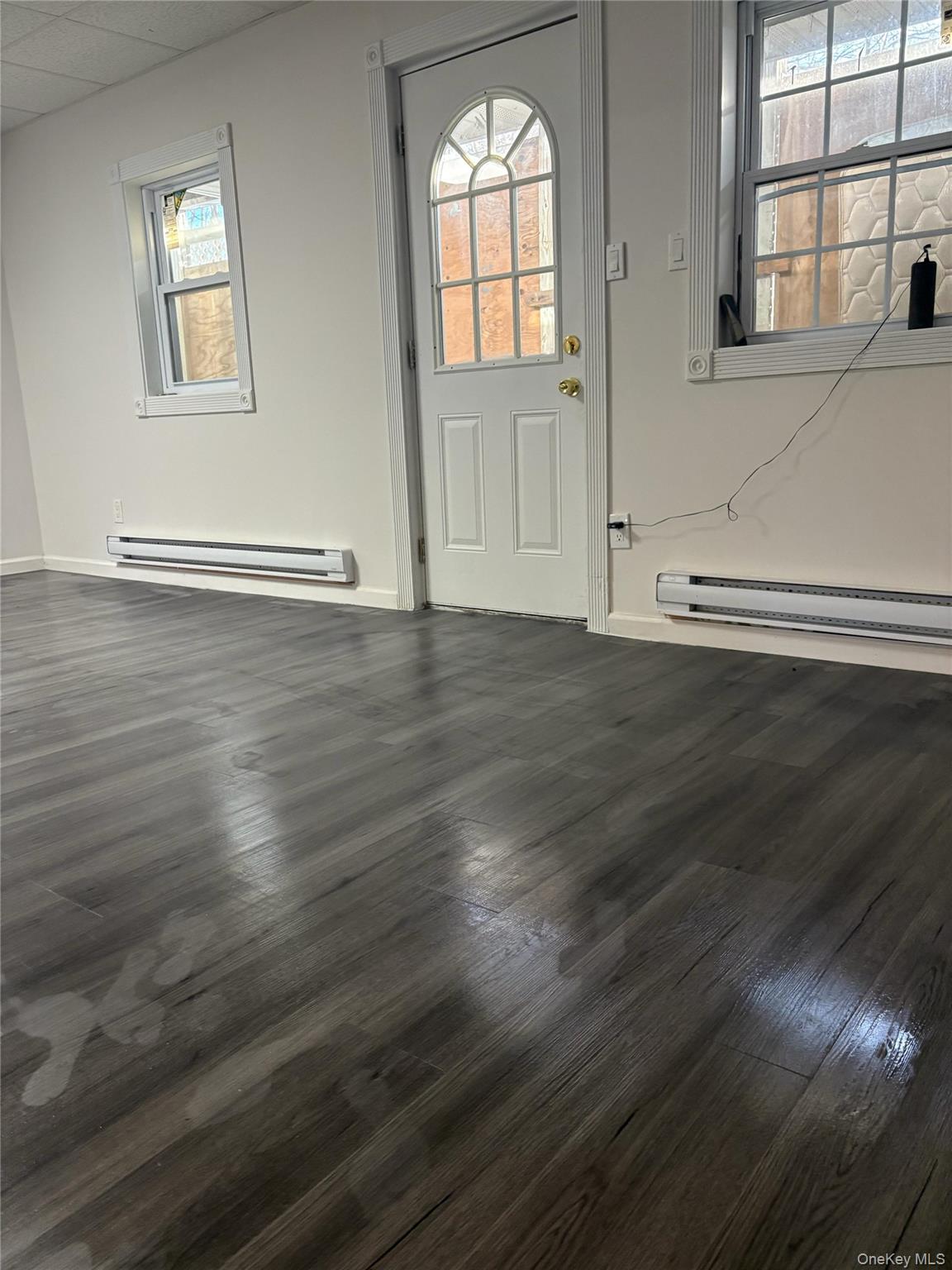 17 Dillon Road Monticello, NY 12701 - Photo 14 of 17 an empty room with wooden floor and windows