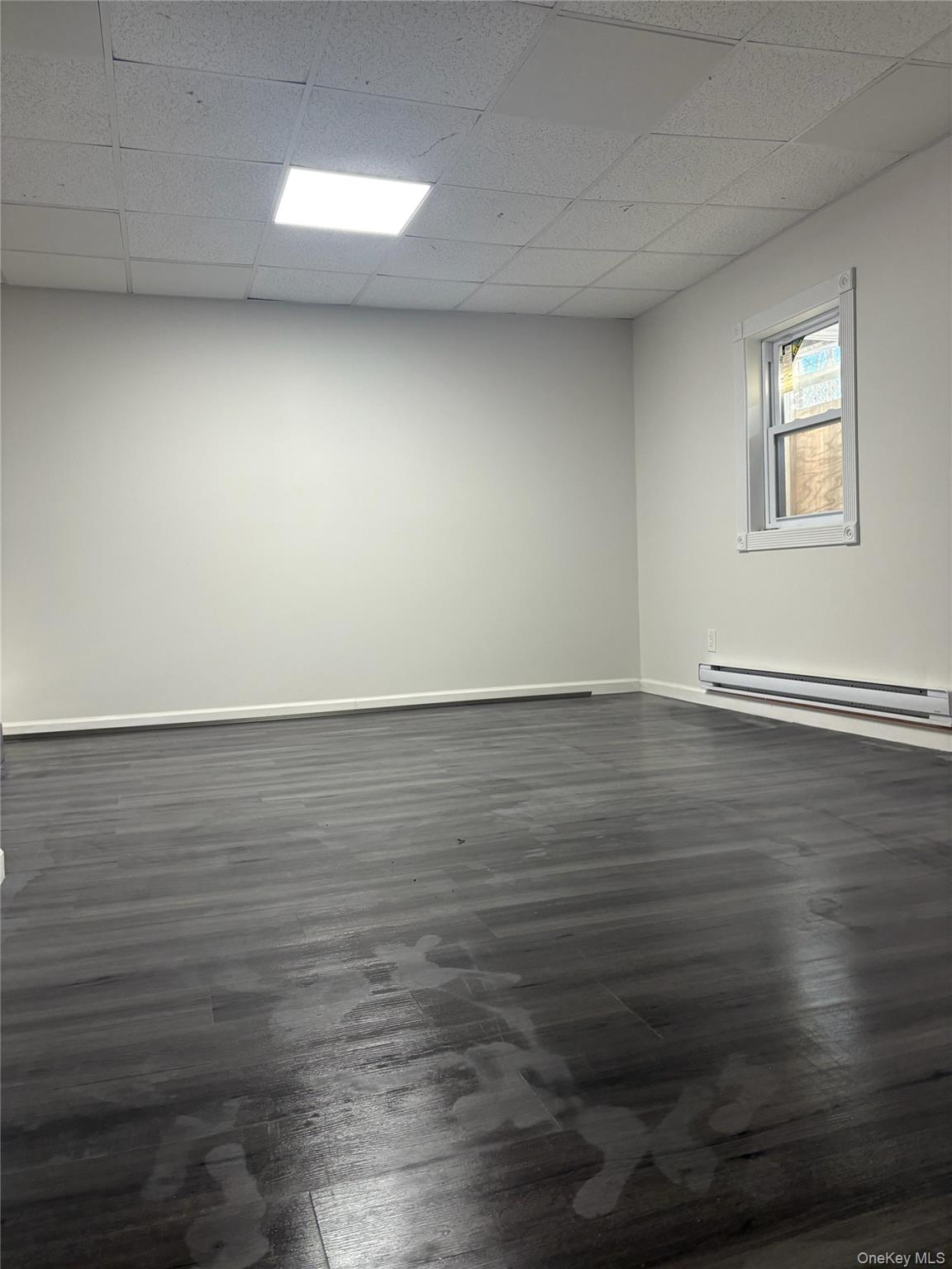 17 Dillon Road Monticello, NY 12701 - Photo 15 of 17 a view of an empty room with wooden floor and a window
