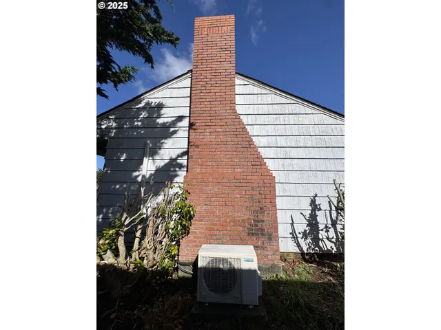 a room with a stove and cabinets