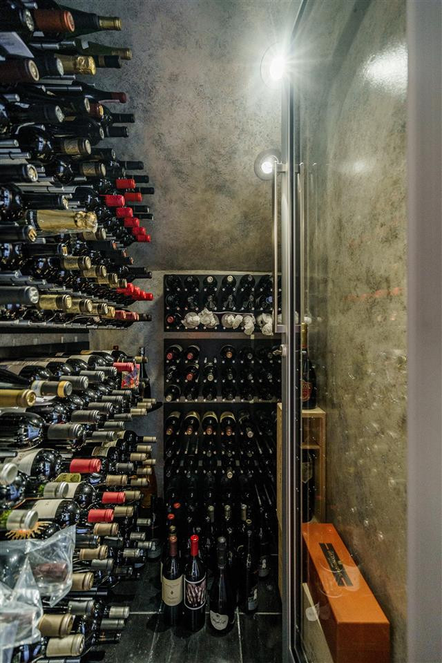3916 Hemsbury Way Raleigh, NC 27612 - Photo 12 of 30 Stunning Custom Walk-In Wine Cellar!! Holds 200+ bottles, Commercial grade Wine Cellar Cooling unit, Custom designed stainless steel bottle racking, special travertine floor, Custom Full Glass Door with lock. Walk-in Wine Cellar Commercial Grade