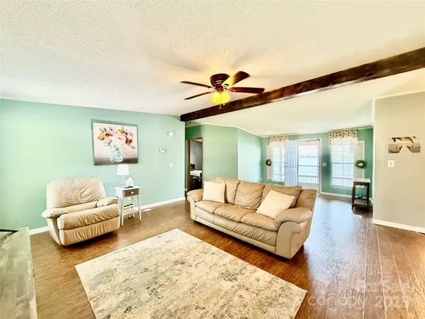a living room with furniture and a rug