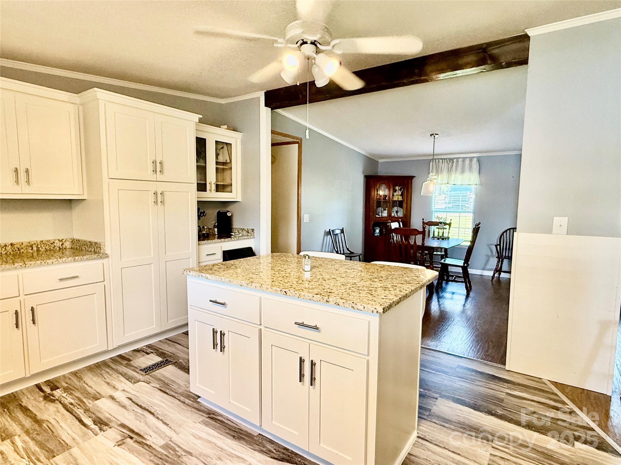 37 Suede Lane Ridgeway, SC 29130 - Photo 16 of 42 a kitchen with cabinets appliances and a wooden floor