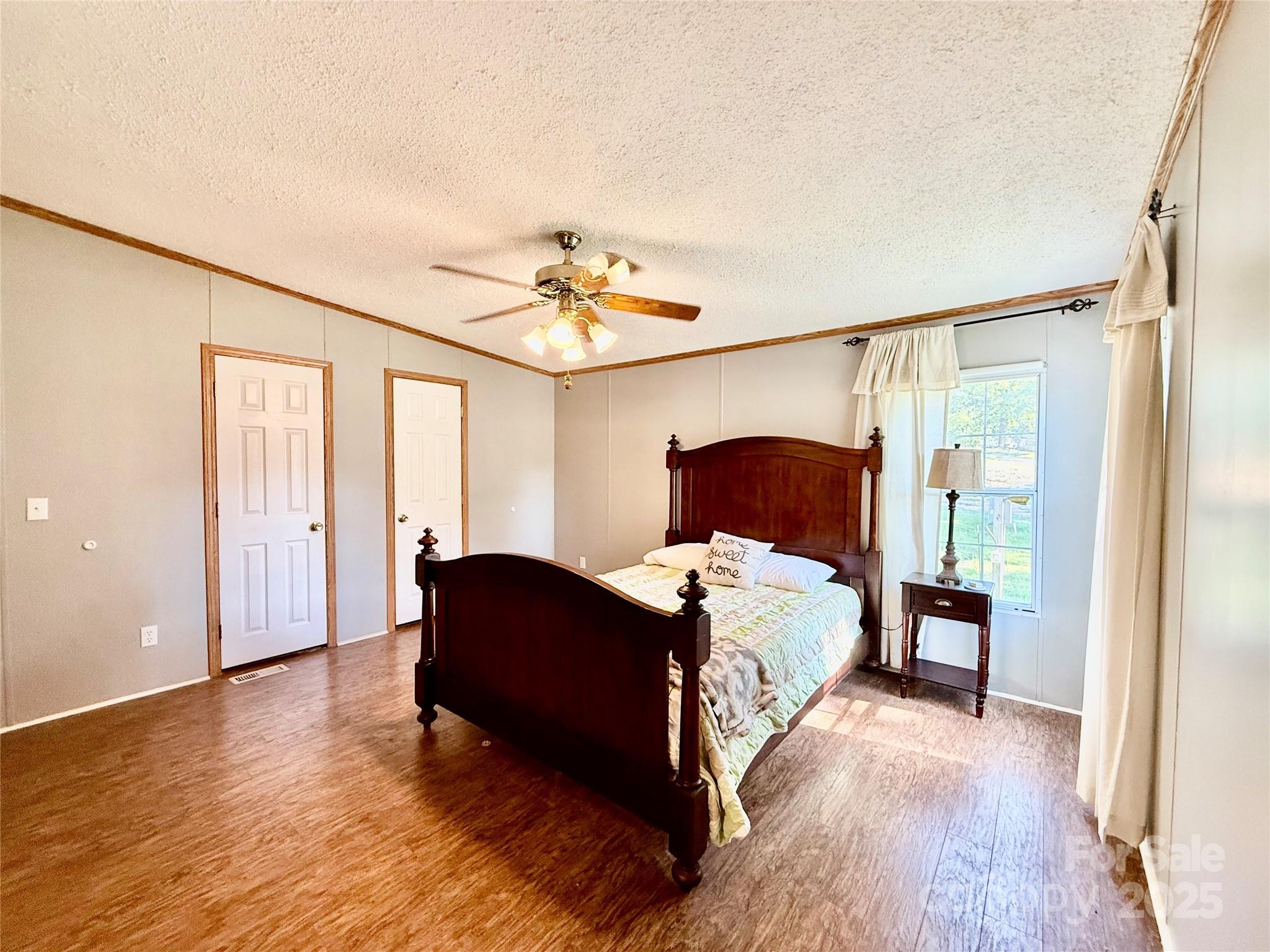 37 Suede Lane Ridgeway, SC 29130 - Photo 18 of 42 a bedroom with a bed and a mirror